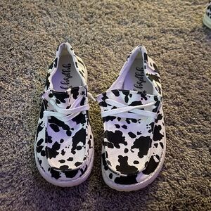 Women’s Black and White Cow Print Slip on